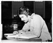 <span itemprop="name">An unidentified male student studying in the...</span>
