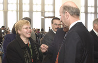 <span itemprop="name">An unidentified woman speaks with newly appointed...</span>