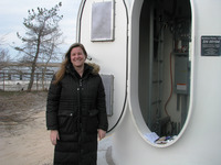<span itemprop="name">Biologist Tara Schneider poses at the base of the...</span>