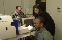 <span itemprop="name">Unidentified persons pose together in the lab at...</span>