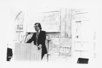 <span itemprop="name">An unidentified man speaking from a podium during...</span>
