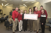 <span itemprop="name">Target Corporation team members (in red) presents...</span>