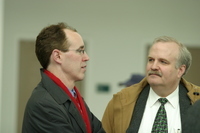 <span itemprop="name">Two unidentified men attend a press conference at...</span>