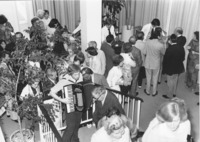 <span itemprop="name">A group of unidentified alumni at a reception...</span>