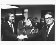 <span itemprop="name">Two unidentified men shaking hands during an event...</span>