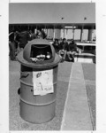 <span itemprop="name">Tom Donelly (in the trash container) in the midst...</span>