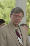 <span itemprop="name">An unidentified person standing at an event...</span>