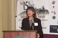 <span itemprop="name">Linda Trocki speaking at the podium at the 15th...</span>