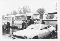 <span itemprop="name">Unidentified people standing by a bus during a...</span>