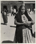<span itemprop="name">A old woman with a black shawl over her head,...</span>