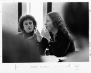 <span itemprop="name">Two female students in class, one of whom is...</span>