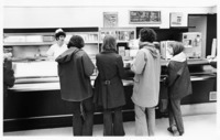 <span itemprop="name">A group of unidentified people purchasing items at...</span>