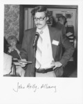 <span itemprop="name">John M. "Tim" Reilly speaking at an event...</span>