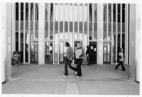 <span itemprop="name">Unidentified students walking by the entrance of...</span>