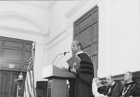 <span itemprop="name">James Baldwin, author, speaking from a podium...</span>