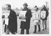 <span itemprop="name">Unidentified people attending a protest associated...</span>