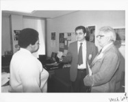 <span itemprop="name">Two unidentified men and an unidentified woman...</span>