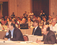 <span itemprop="name">Unidentified audience members listen to an address...</span>
