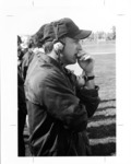 <span itemprop="name">A close-up photograph of a coach watching a game...</span>