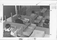 <span itemprop="name">Unidentified students seated in cubicles taking a...</span>