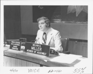 <span itemprop="name">Assemblyman Melvin H. Miller in a hearing room....</span>