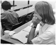 <span itemprop="name">An unidentified student listening to a lecture at...</span>
