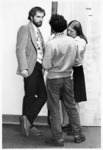 <span itemprop="name">Three unidentified students standing in a hallway...</span>