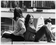 <span itemprop="name">Two unidentified students sitting outside at the...</span>