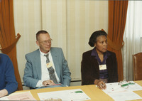 <span itemprop="name">Two unidentified people attending a workshop...</span>