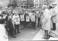<span itemprop="name">An unidentified man speaking during a protest...</span>