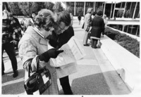 <span itemprop="name">Two people looking at a map of the State...</span>