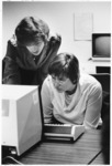 <span itemprop="name">Two unidentified women looking at a computer...</span>