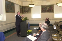 <span itemprop="name">An unidentified speaker addresses the audience at...</span>
