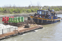 <span itemprop="name">Canal employees aboard the tug Waterford bring...</span>