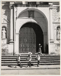<span itemprop="name">Three young children in hats walking by the steps...</span>