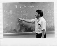 <span itemprop="name">A photograph of John Stutz teaching a class...</span>