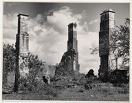 <span itemprop="name">A ruin structure with three brick chimneys....</span>