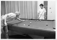 <span itemprop="name">Two unidentified students playing a game of pool...</span>