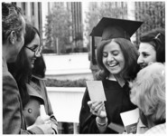 <span itemprop="name">An unidentified graduating student with her family...</span>