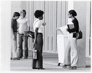 <span itemprop="name">Unidentified students talking outside of a...</span>