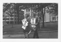 <span itemprop="name">Unidentified people holding signs and...</span>