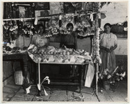 <span itemprop="name">Three young women at a table stand with fruit and...</span>