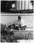 <span itemprop="name">An unidentified female student reading on the...</span>