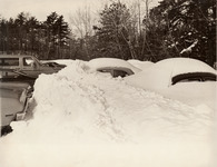 <span itemprop="name">A winter scene of cars covered in snow in an...</span>