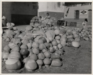 <span itemprop="name">A large pile of clay pots stacked on the ground...</span>