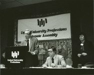 <span itemprop="name">Fred Miller speaking from a podium during a United...</span>
