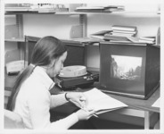 <span itemprop="name">A STUDENT LOOKING AT SLIDES An unidentified...</span>