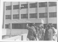 <span itemprop="name">Unidentified students standing outside of the...</span>