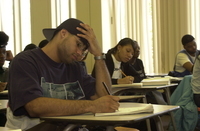 <span itemprop="name">A student takes notes during math class in the...</span>