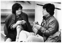 <span itemprop="name">Two unidentified students sitting and eating on...</span>